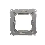 Simon Basic WMUZ-74x3xx-4012 Adapter (przejściówka) na osprzęt standardu 45 × 45 mm. Montaż do puszki na łapki i wkręty; srebrny mat